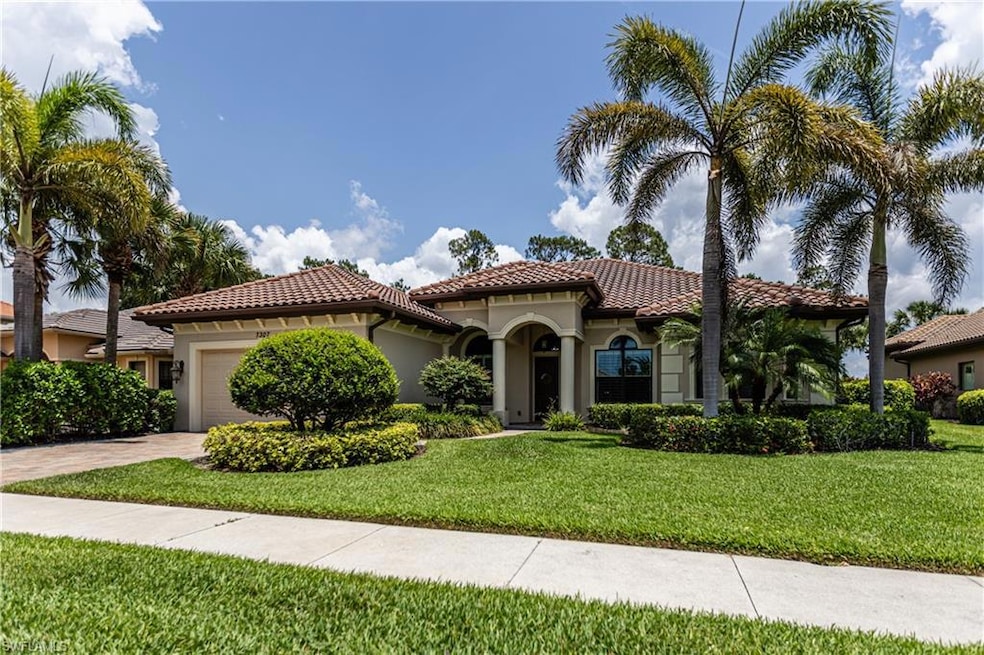 Mediterranean / spanish-style house featuring stucco siding, an attached garage, a tiled roof, and driveway