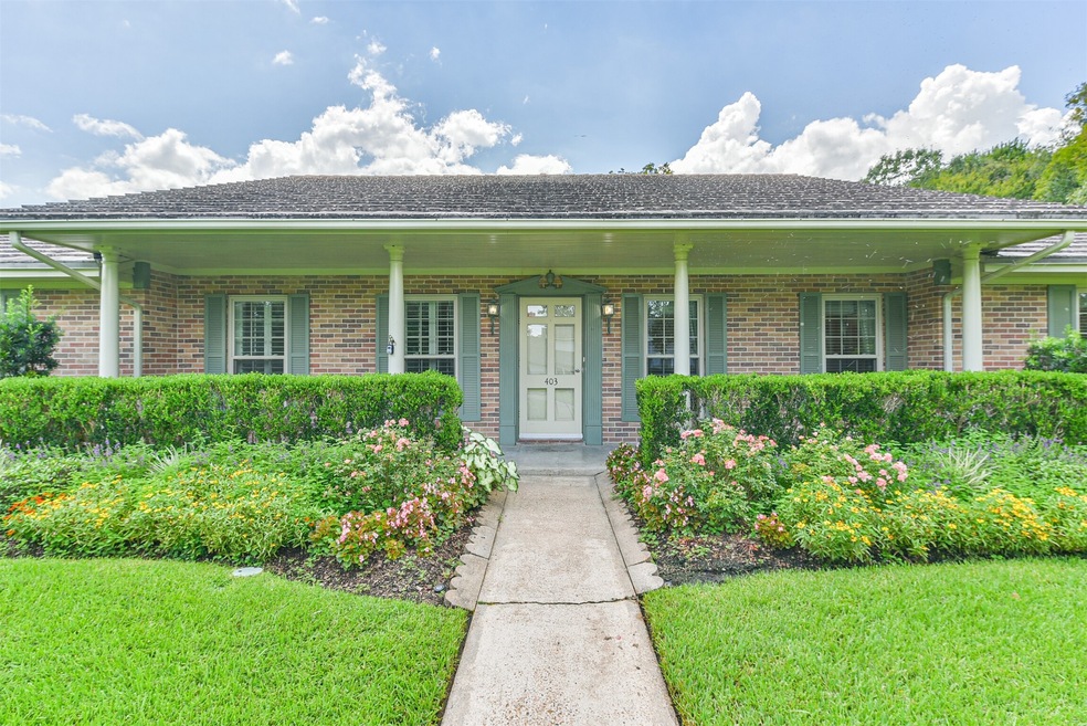 Beautifully landscaped with gorgeous flowers and plants.