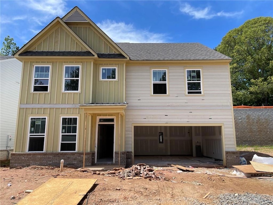 View of front of house with board and batten sidin