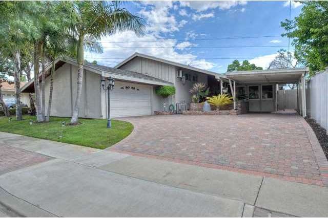 Tons of curb appeal - note the custom pavers, extr