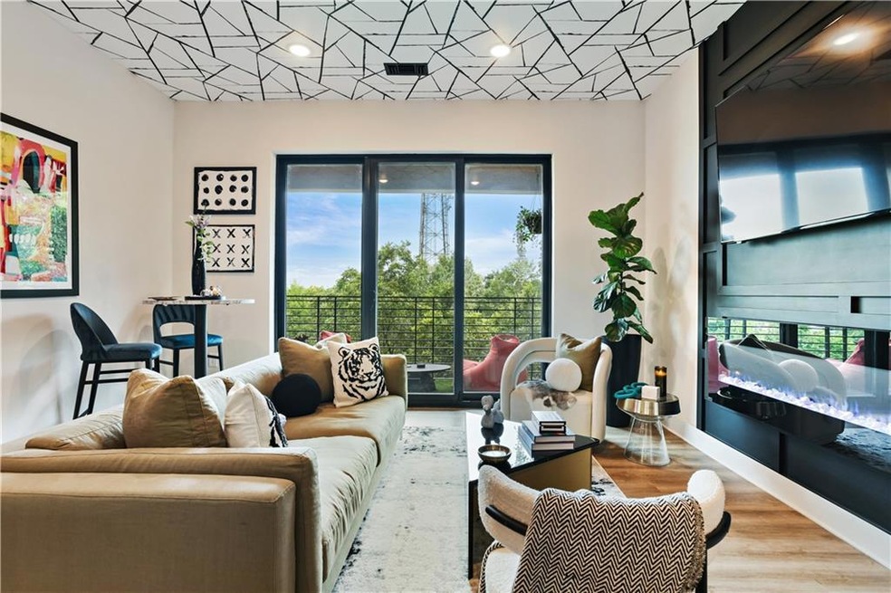 Living room featuring wood finished floors and recessed lighting