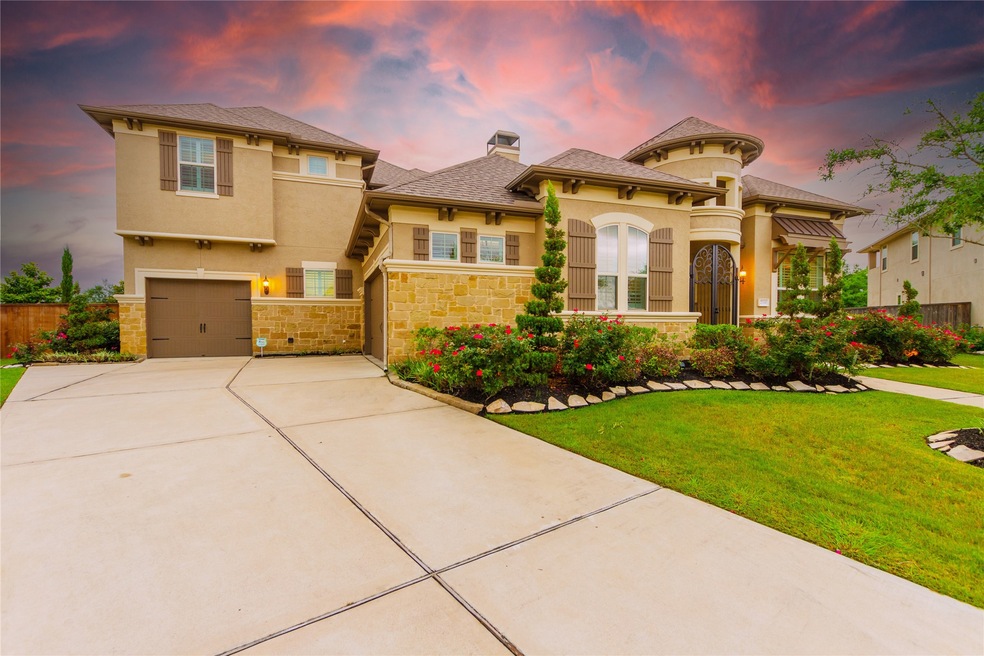 Welcome home to 27330 Cheshire Edge Lane located in Avalon at Spring Green and zoned to Katy ISD. This stunning home has lovely curb appeal, a well-manicured lawn, beautiful landscaping, stone/stucco elevation, gated courtyard, dark stained shutters, beautiful outdoor lanterns, and a double wide driveway.