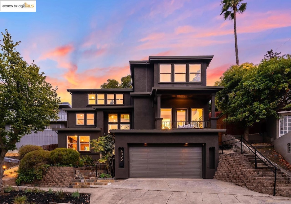 View of front of home with an attached garage, driveway, stucco siding, and a balcony