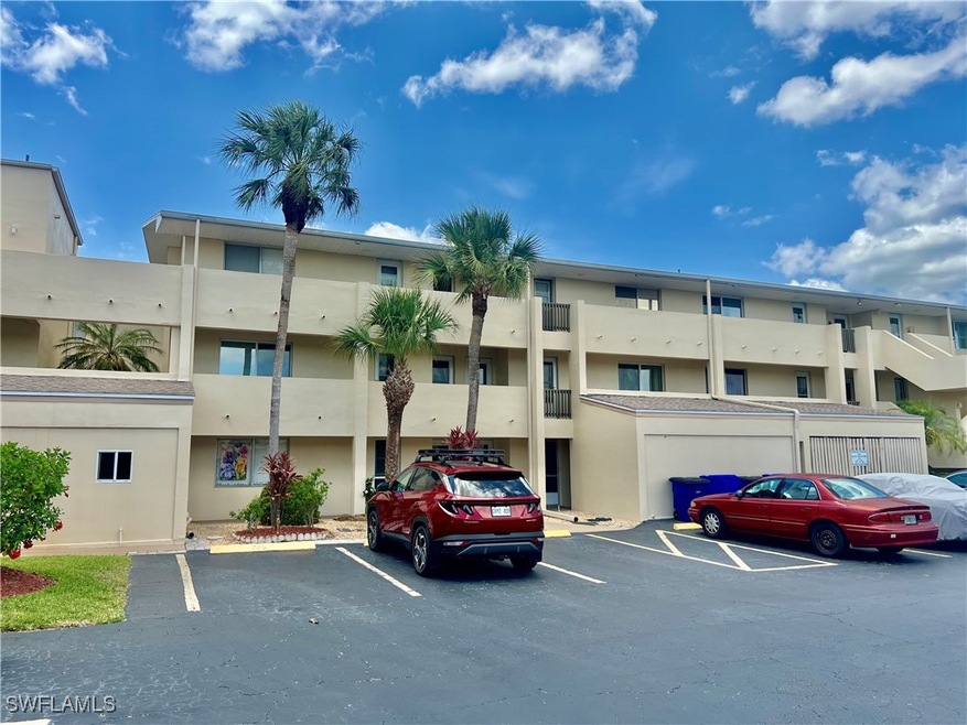 View of property with  parking