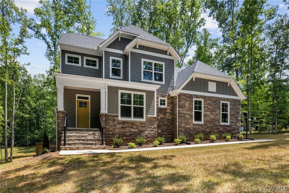 Craftsman-style house featuring a front yard
