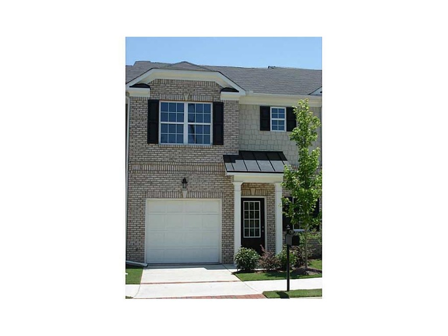 Exterior Front. Brick front, cement siding rear an