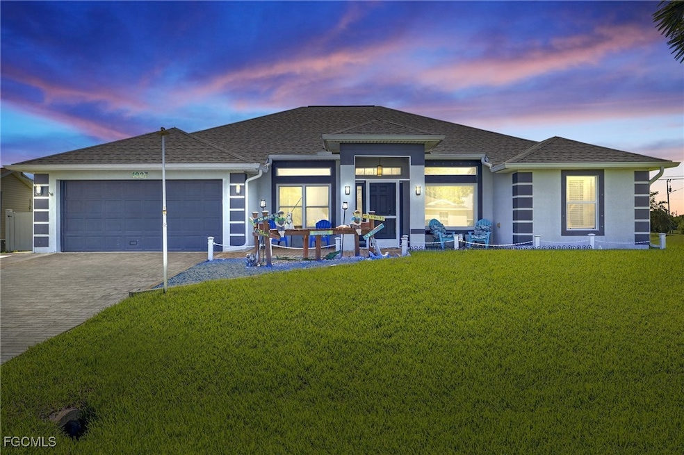 View of front facade with a garage, a shingled roo