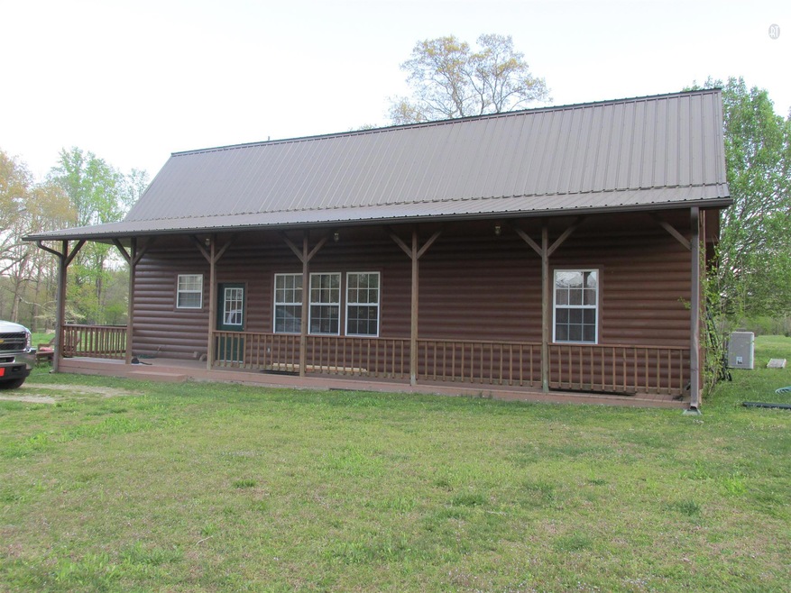 Beautiful 5 Bd. 3 full baths log home sitting on 10.45 acres with barn completely fenced