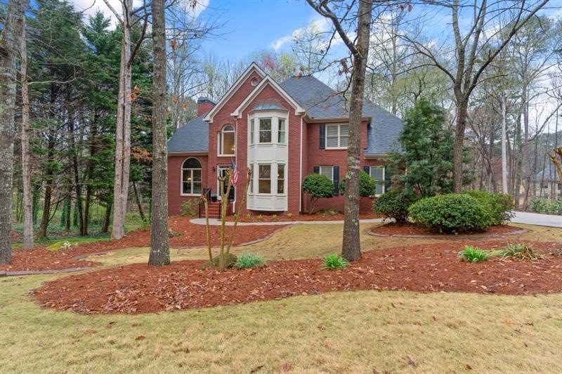 Custom three side brick house on over a half acre 