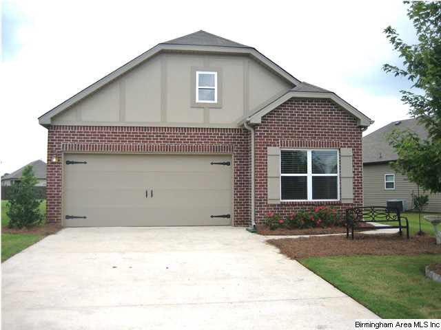 Charming facade with well maintained landscape rea