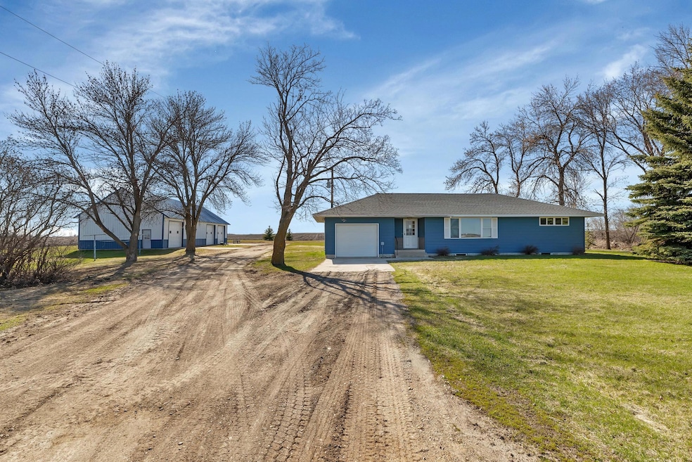 Welcome to 24039 293rd Avenue, Paynesville. This home sits on 5 acres in a lovely & peaceful country setting!