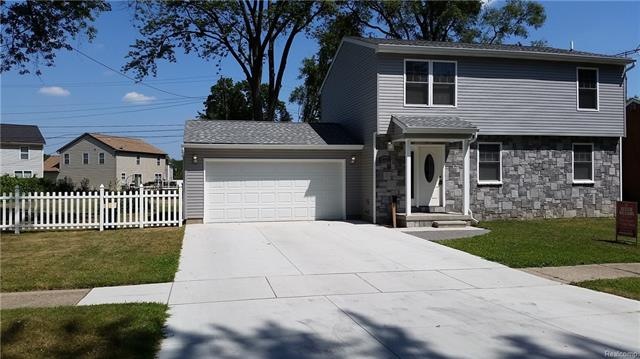 Wide lot and double wide drive way.