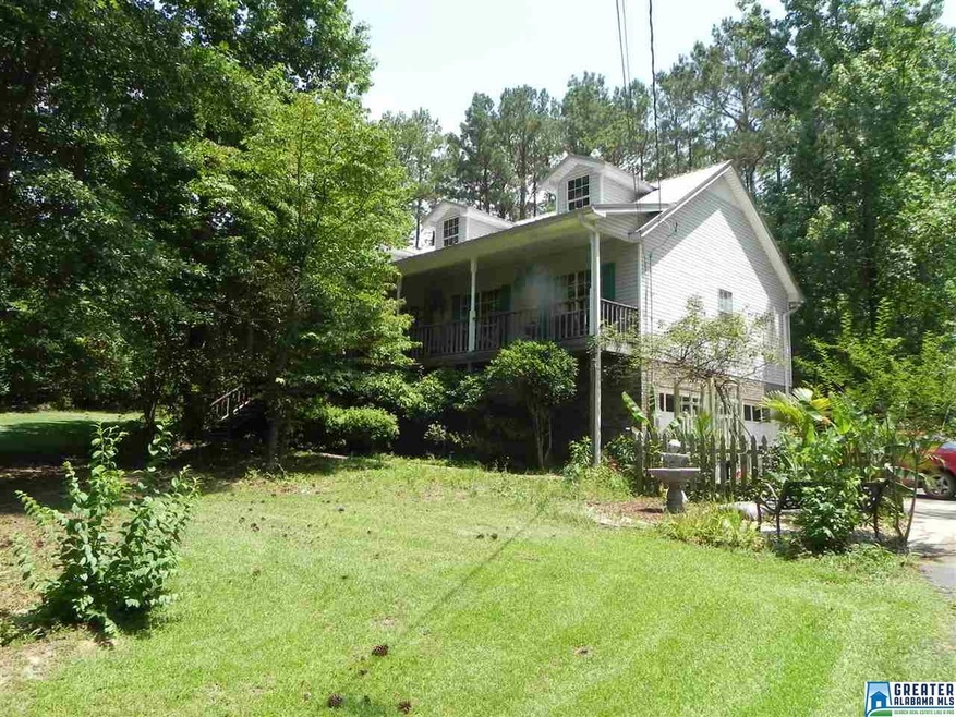 NESTLED BACK FROM ROAD ON TREE STUDDED 3 ACRES