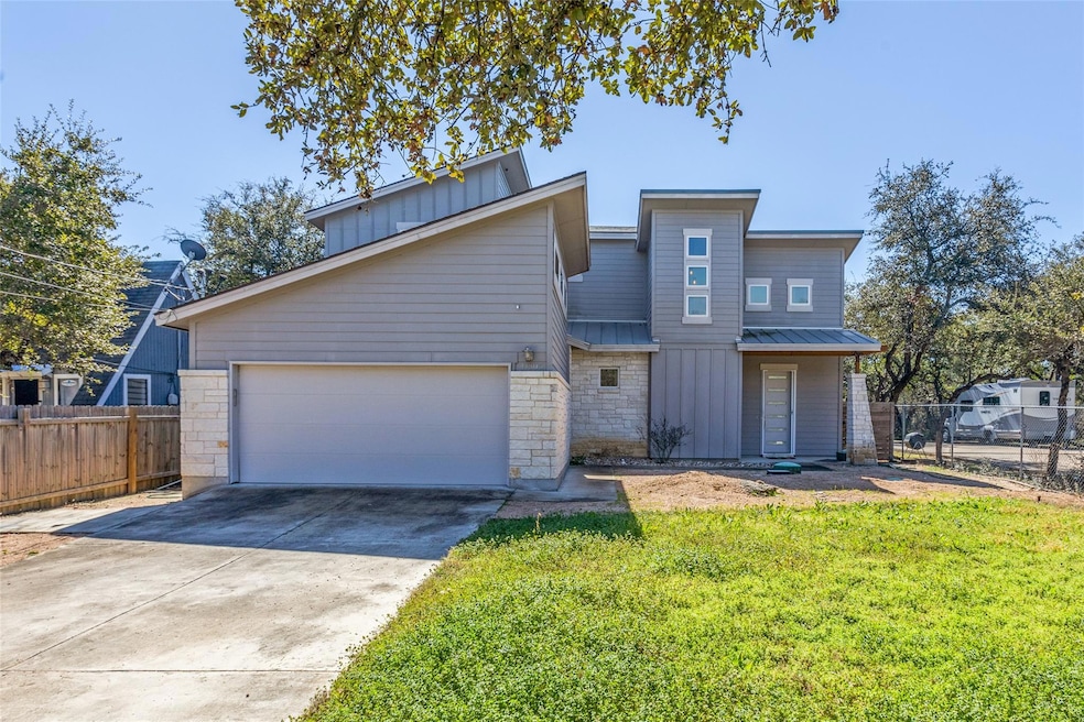 View of front of home featuring driveway, board a