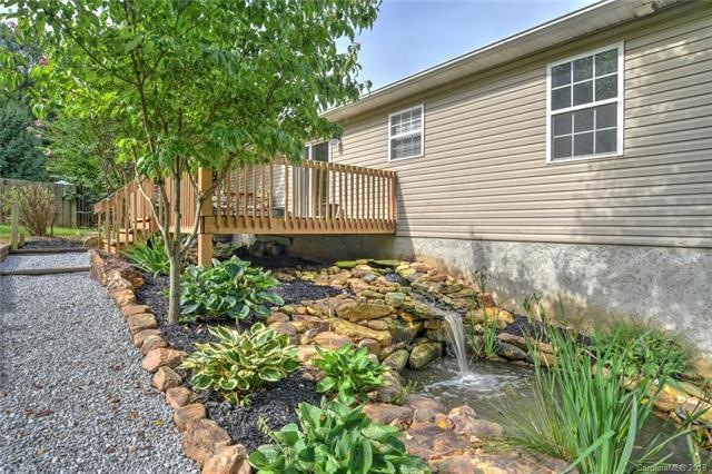 A waterfall, stone feature, hostas, lilies and mor