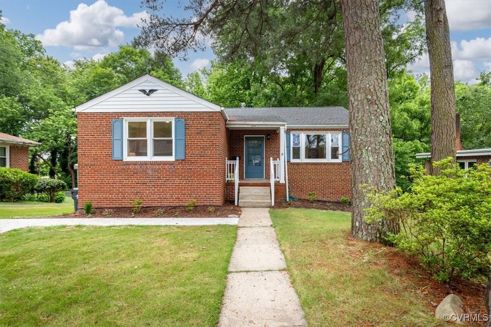View of front of home featuring brick siding and a