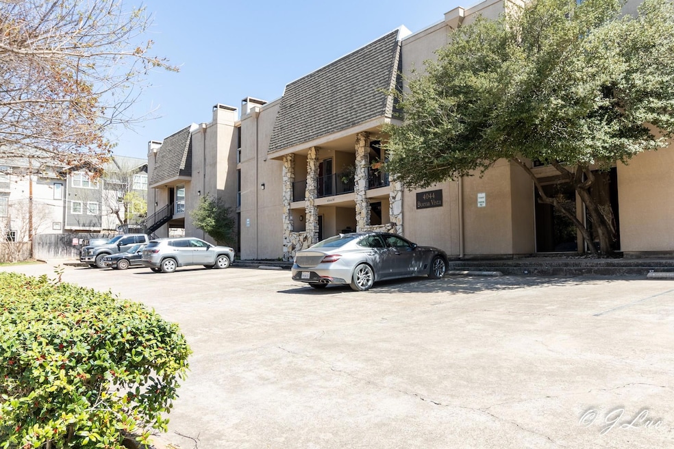 View of property featuring uncovered parking