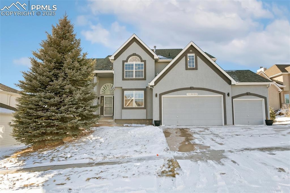 Front of property featuring a 3 car garage