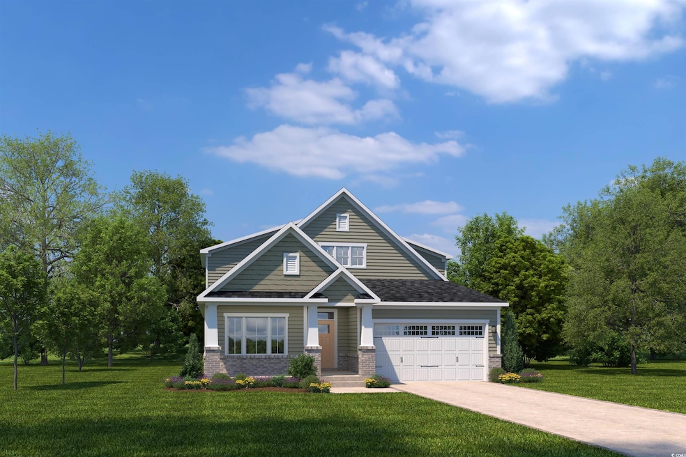 View of front of house with driveway, a front lawn, brick siding, and an attached garage