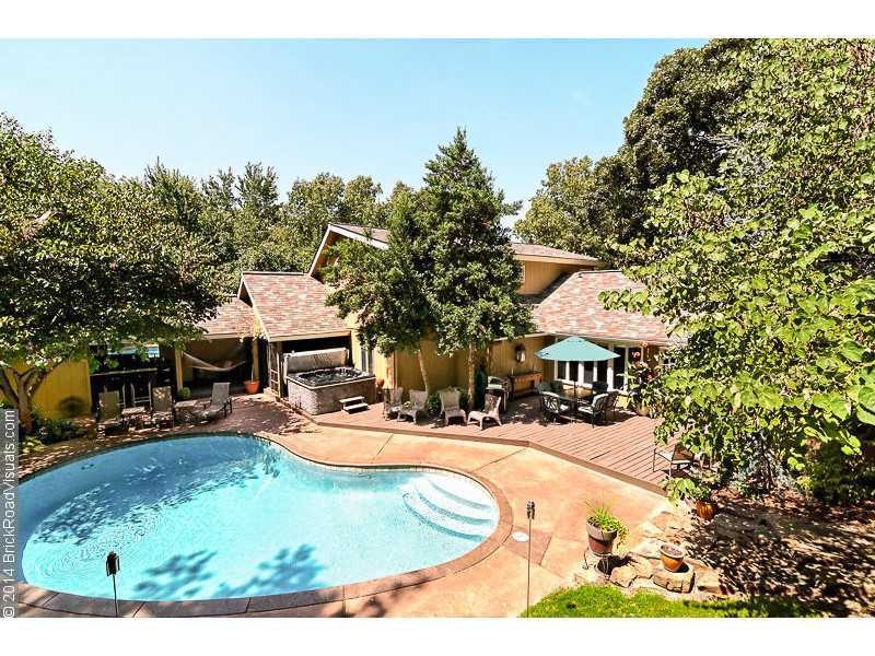 Exterior Back. Enjoy a private oasis only 1 mile to Wal Mart home office - yet a world away from everything