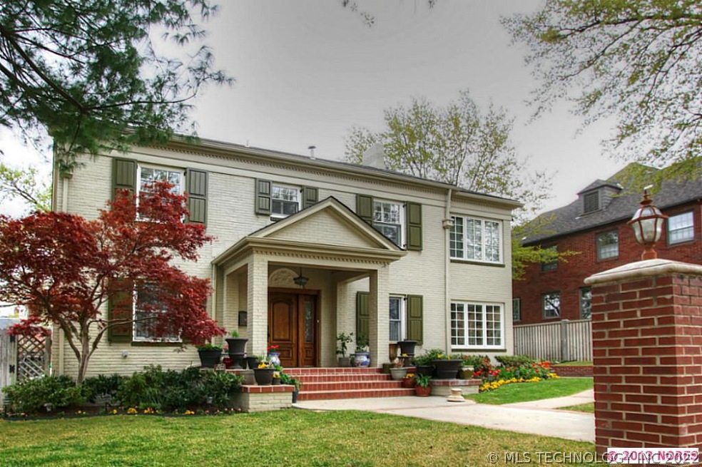 This full brick home offers a colonial style with