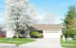 Front view with pear tree in bloom
