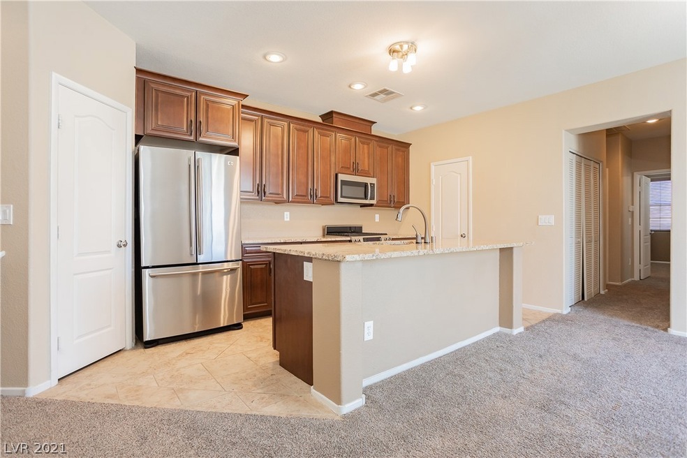 Island kitchen with granite counters, stainless st