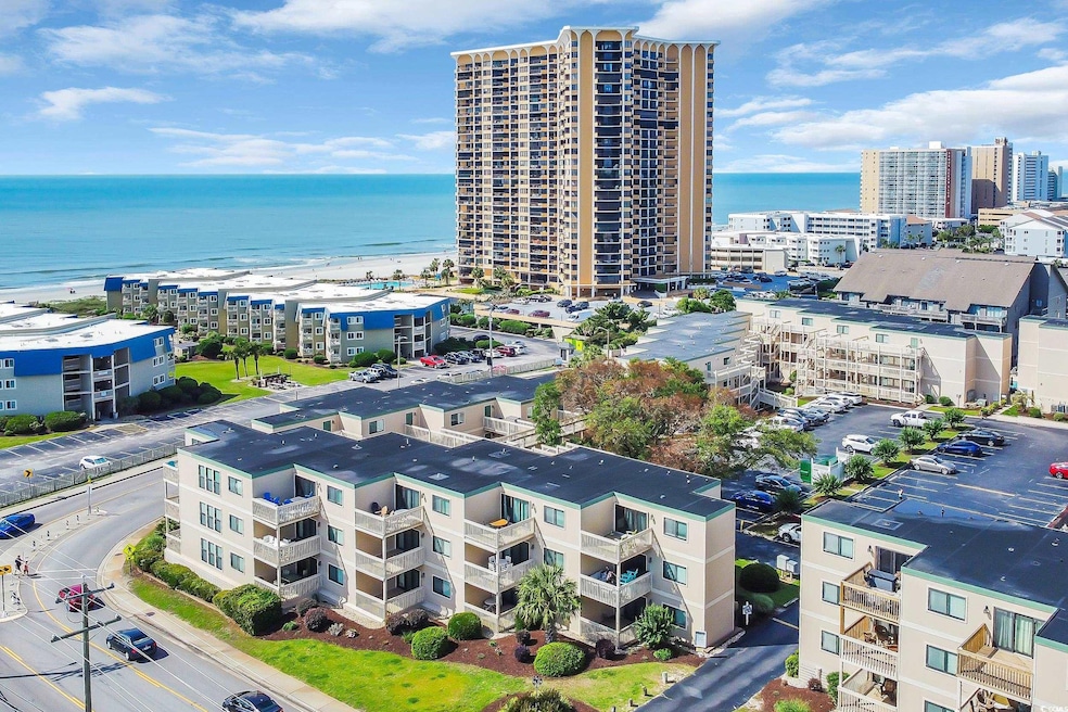 Bird's eye view of a large body of water and apartment complex / building