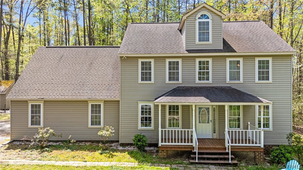 Rear view of house featuring covered porch