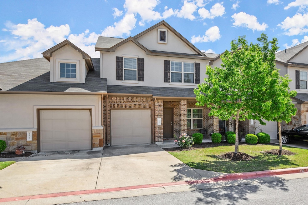 View of front of home with stucco siding, concret