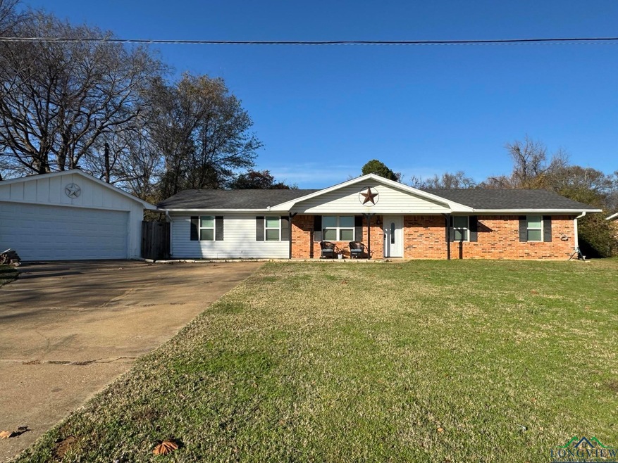 Single story home featuring a garage, an outdoor s