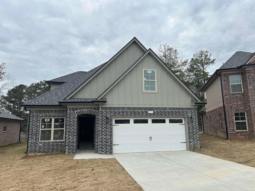 View of front of property featuring a garage