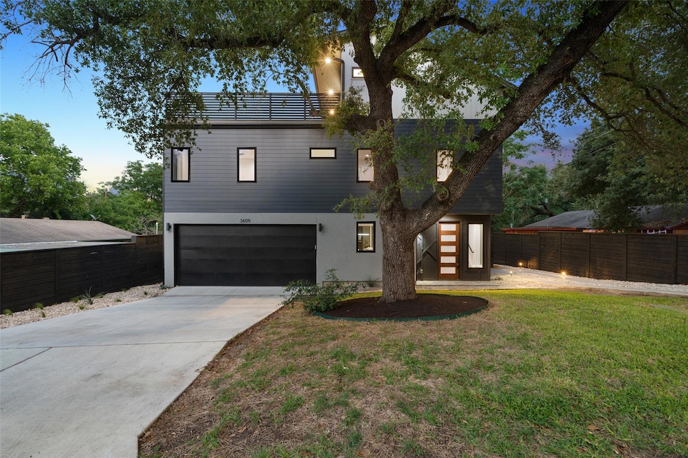 Contemporary house featuring a garage, driveway, 