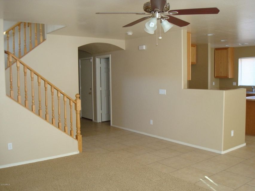 view of stairs and kitchen