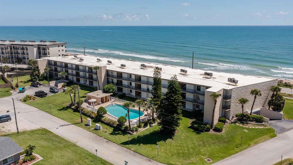 3 story building on Atlantic Ocean. Unit has views from most rooms inside and the covered balcony.