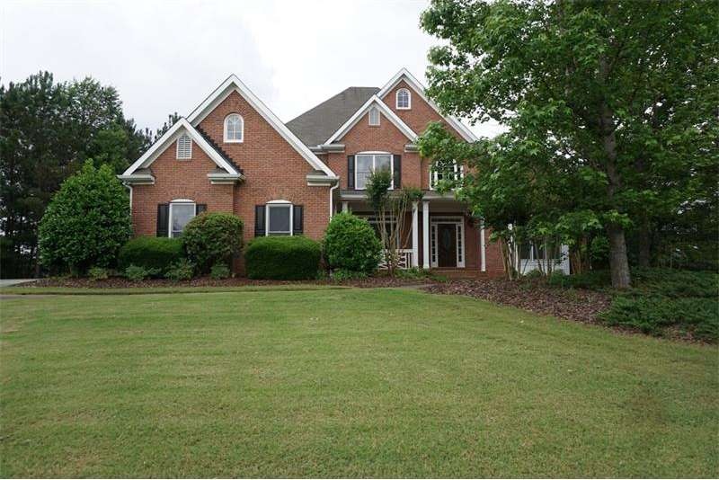 Immaculate Brick Home on acre lot with full perime