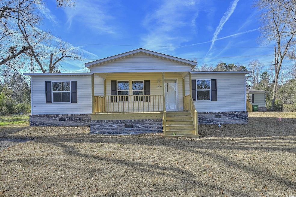 View of front of house with crawl space and covered porch