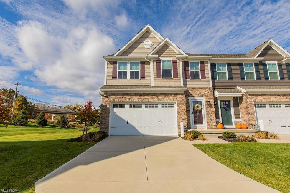 View of front of house with garage and a front law