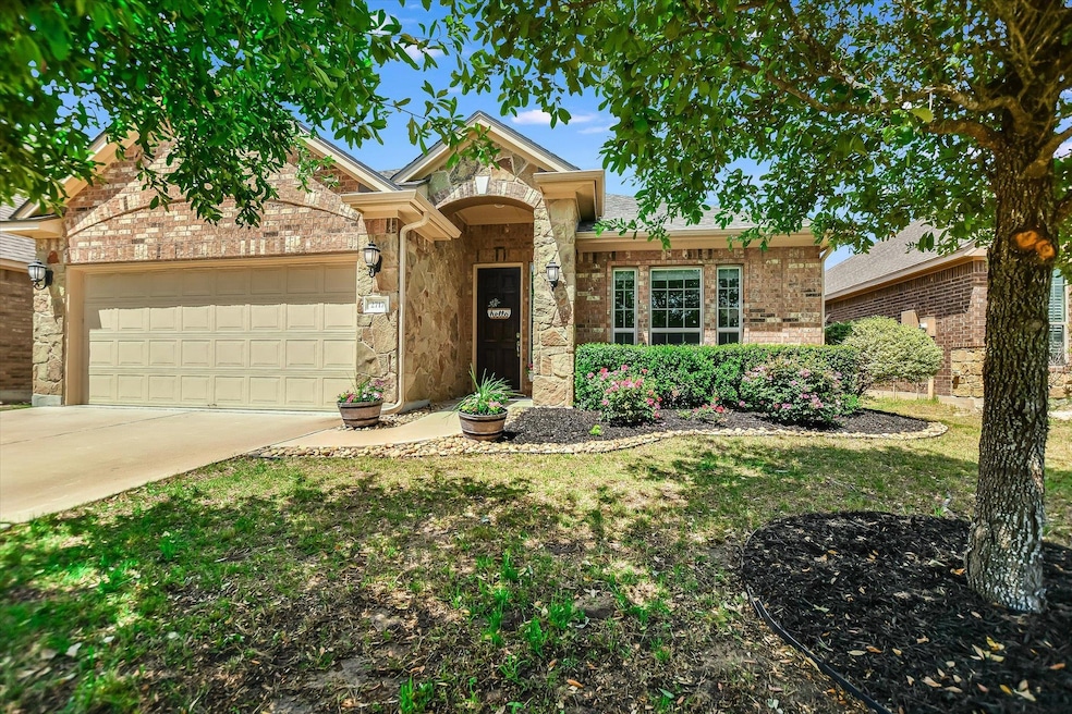 Single story home featuring an attached garage, c