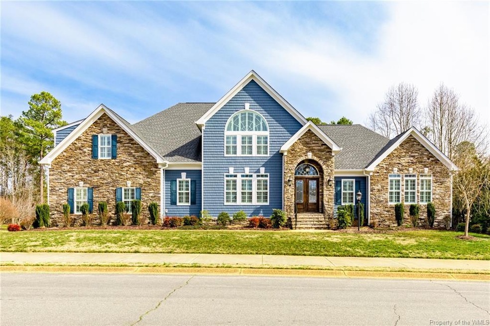 Magnificent Craftsman style home in Stoneshouse is situated on a corner lot with an in-ground pool and 3 car garage!