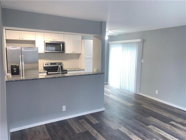 Unit 2 living room facing kitchen