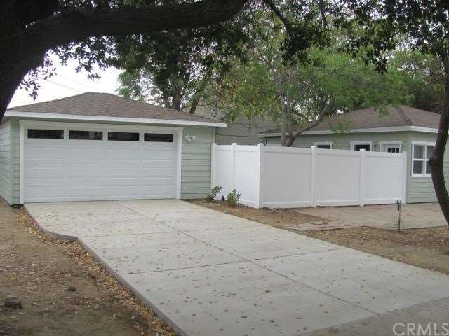 NEW GARAGE DOOR AND NEW CONCRETE DRIVEWAY