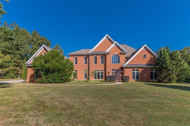 This 4 side brick beauty sits on a beautiful 4 acr