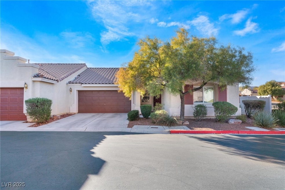 View of front of home featuring stucco siding, an