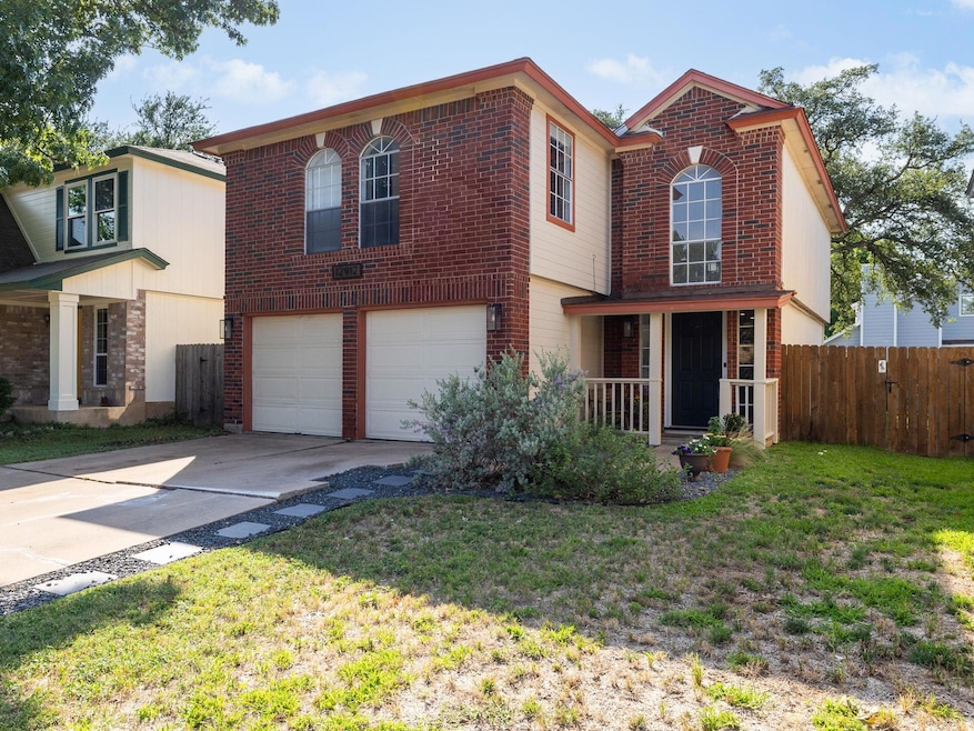 Traditional-style house with a garage, concrete d