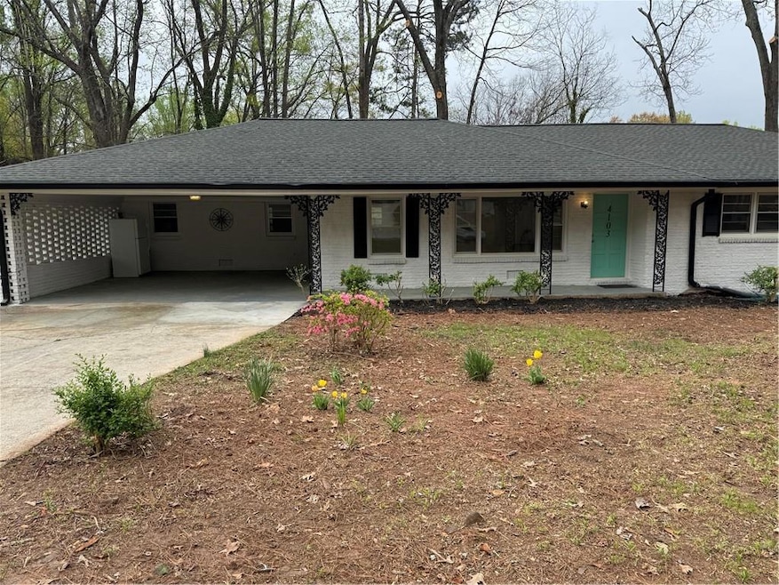 Single story home with driveway, roof with shingle