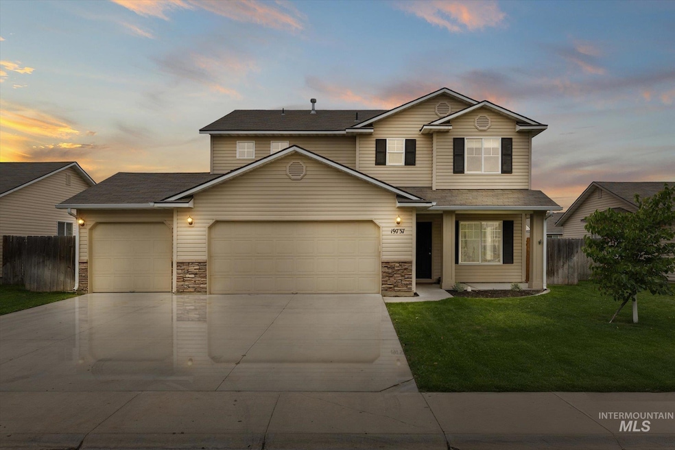 Traditional home with stone siding, driveway, a garage, and roof with shingles