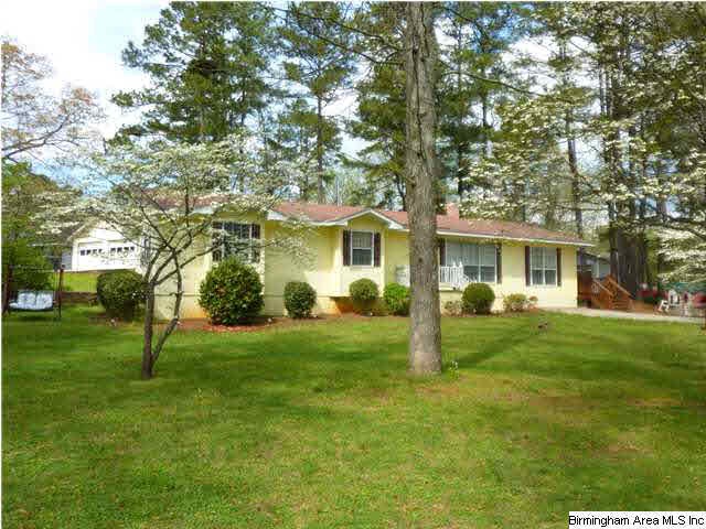 Corner lot in Columbiana with lots of mature trees