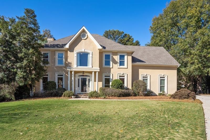 Gorgeous Hard Coat stucco home In Swim/tennis subd