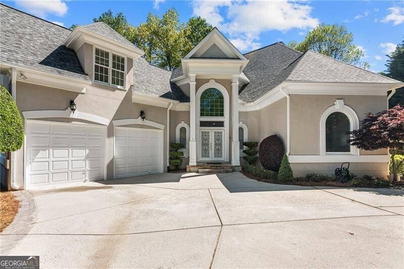 View of front facade featuring a garage